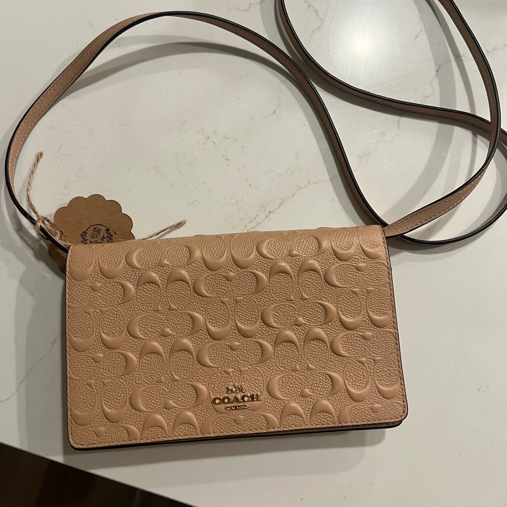coach cross body purse! perfect condition. hand size for reference!